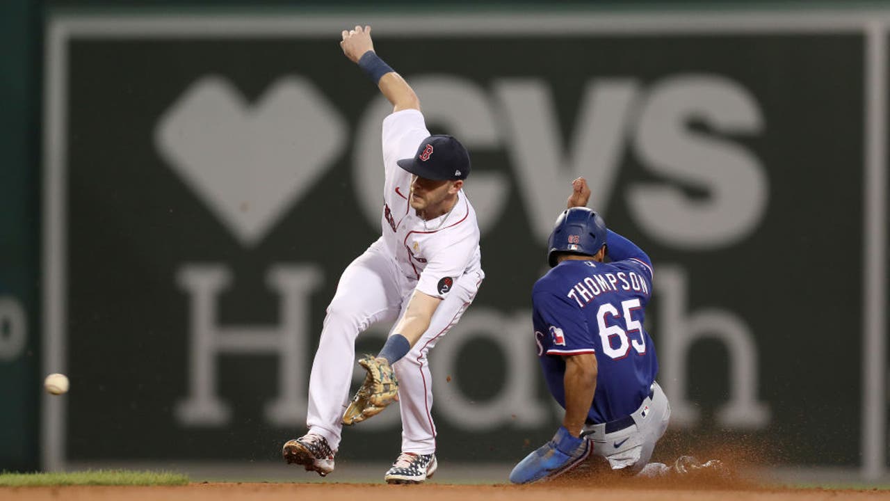 Texas Rangers outfielders Charlie Culberson, left, Leody Taveras