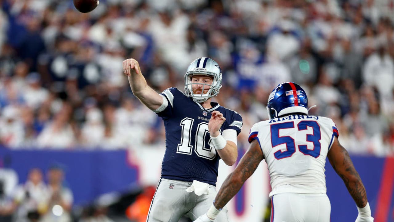 Dallas Cowboys quarterback Cooper Rush (10) hands the ball off