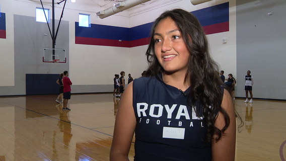 Female high school football player makes first catch of the season