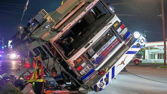 Fort Worth fire engine flips over in rollover crash, injuring four firefighters