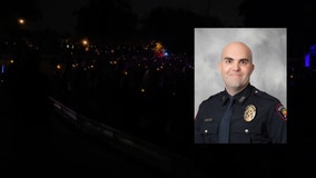 Carrollton police officer killed in the line of duty remembered at candlelight vigil