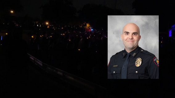 Carrollton police officer killed in the line of duty remembered at candlelight vigil