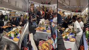 Video: NYC subway riders enjoy Thanksgiving feast on L train