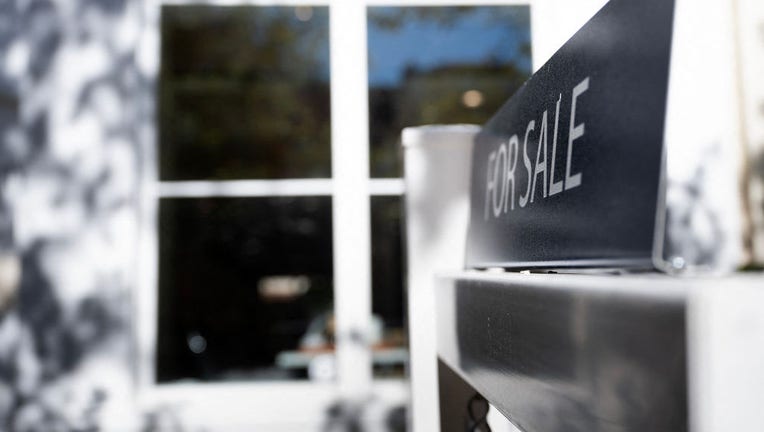 FILE - A residential real estate for sale sign is seen as inflation and interest rates increase on Oct. 27, 2022, in Washington, DC. (Photo by BRENDAN SMIALOWSKI/AFP via Getty Images)