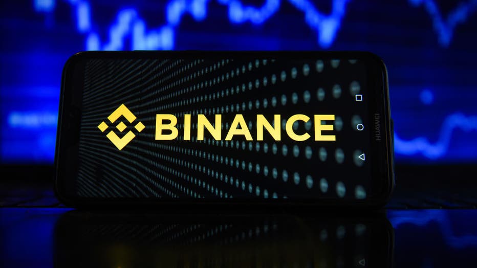 In this photo illustration a Binance logo seen displayed on
