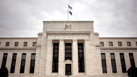 Fed raises key interest rate by half a point, signals more to come