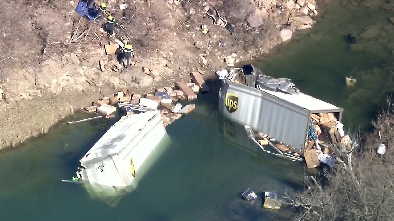 UPS 18-wheeler crashes through guardrail in Ferris, falls into creek below