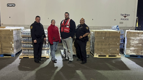 Fort Worth police officers deliver water to Ohio town dealing with devastating train derailment