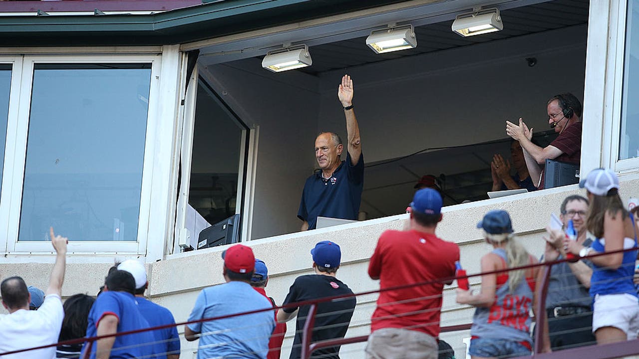 Members of the Texas Rangers' 40th Anniversary All-Time Team pose with announcer Eric Nadel, who was inducted into the team's Hall of Fame prior to the start of the game against the