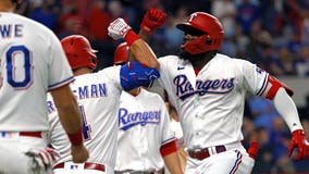 Heaney has AL record-tying 9 straight Ks, Rangers top Royals