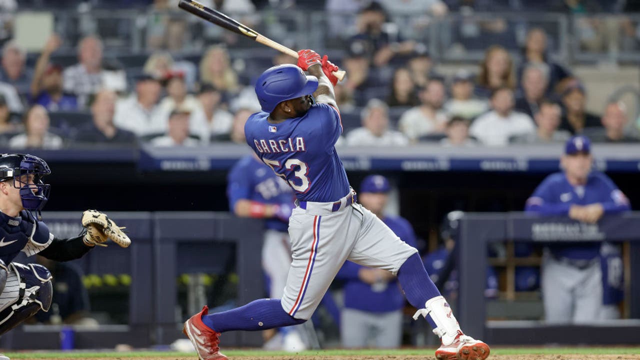 Texas Rangers' Mitch Garver runs to first after hitting an RBI single  against the New York Yankees during the eighth inning of a baseball game  Friday, June 23, 2023, in New York. (