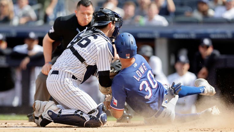 New York Yankees catcher Kyle Higashioka (66) hits a two run home