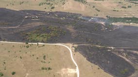 Crews working to put out grass fire in Wise County