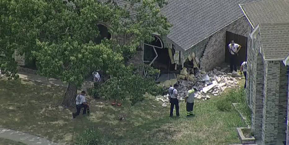 Elderly man crashes into Arlington home after passing out behind wheel