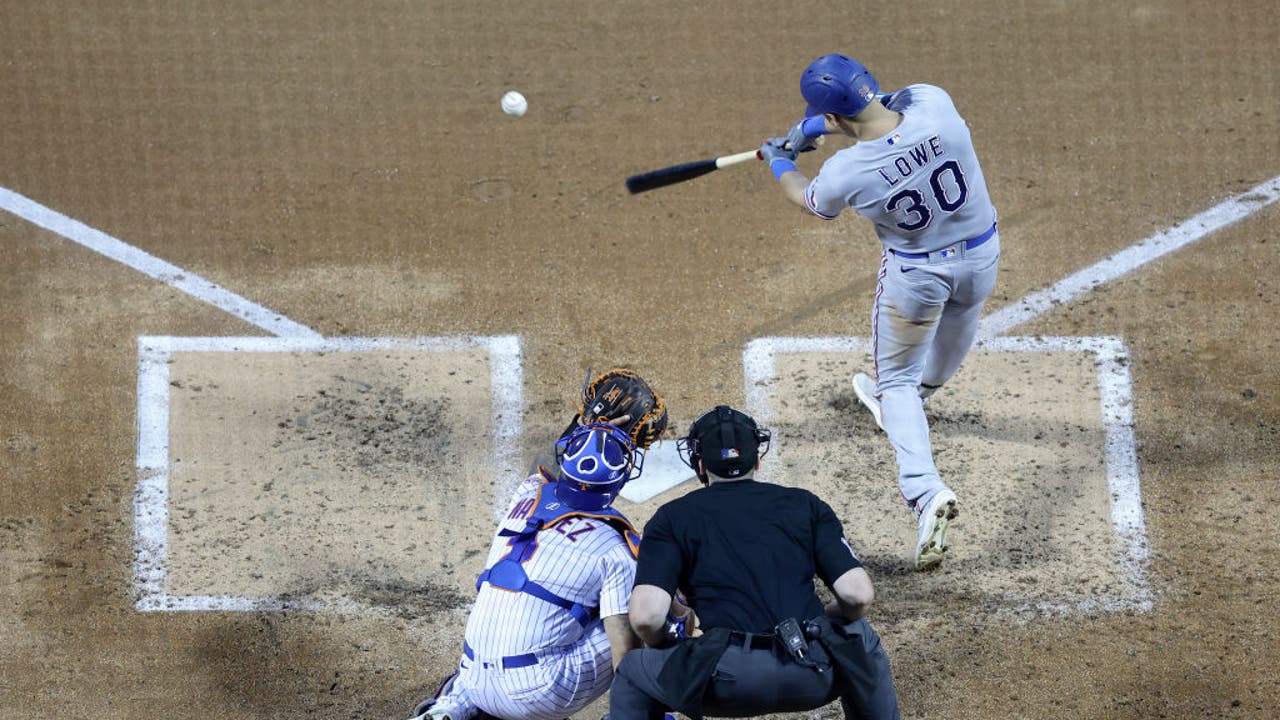 Marcus Semien of the Texas Rangers blows a bubble in the sixth inning  News Photo - Getty Images