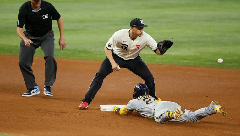 Santana's 3-run homer in the 7th leads Brewers past Rangers in