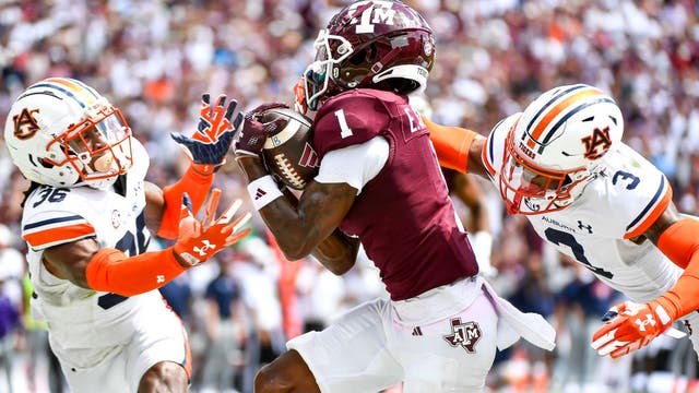 Johnson throws 2 TD passes after Weigman injured to lead Texas A&M to 27-10 win over Auburn