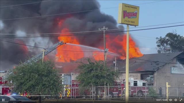 Dallas fire crews battle three-alarm fire at auto shop