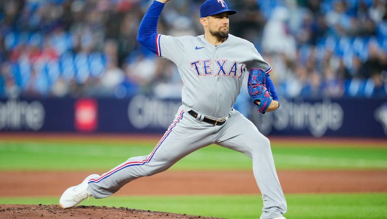 Trevor Richards of the Toronto Blue Jays pitches against the Texas