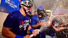 PHOTOS: Texas Rangers celebrate wild card win with champagne showers