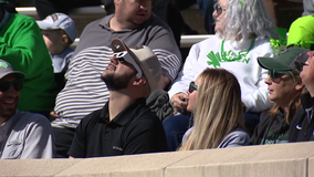 UNT football fans enjoy the solar eclipse while watching game