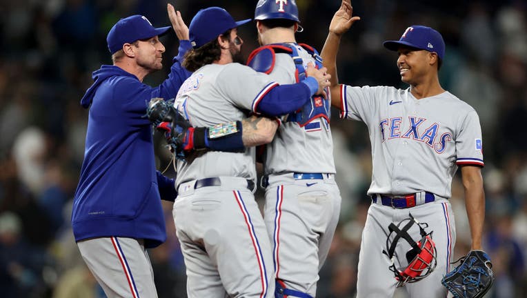 Rangers get 6-1 win over Mariners to clinch playoff spot