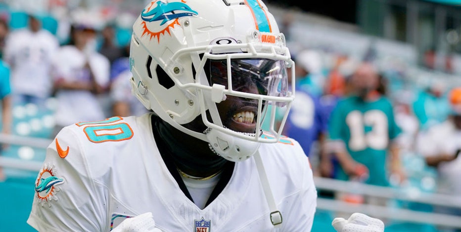 FILE - AFC wide receiver Tyreek Hill, of the Miami Dolphins, warms