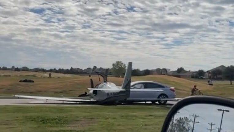 Plane goes off runway crashes into car during emergency landing