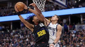 Murray scores 22 points as Nuggets race by Doncic and Mavericks 130-104