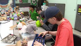 Aledo High School robotics team reconfiguring toys for children with disabilities