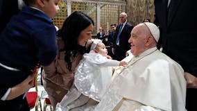 Pope Francis individually baptizes infants during annual ceremony at Sistine Chapel