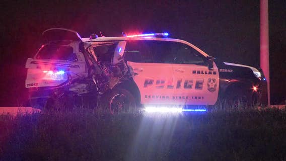 Dallas PD officer injured after squad car struck while blocking traffic