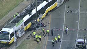 Car wraps around pole after colliding with DART train in Oak Cliff