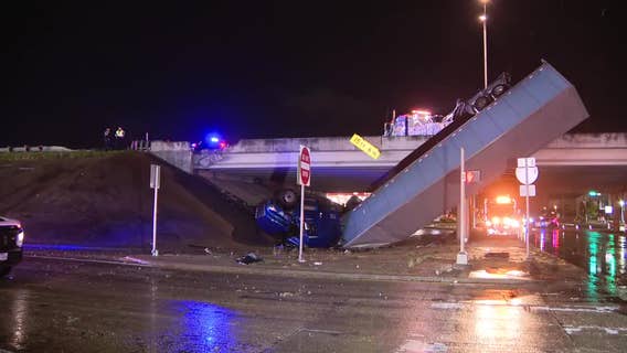 Crash leaves semi-truck dangling over I-35W in Fort Worth amid heavy rain