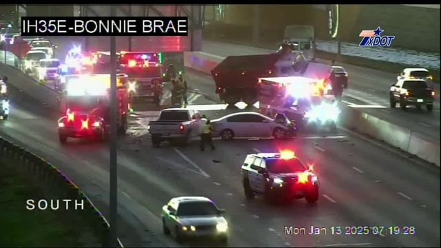 Crash on I-35E near UNT leaves dump truck dangling; hazardous waste cleanup causes delays
