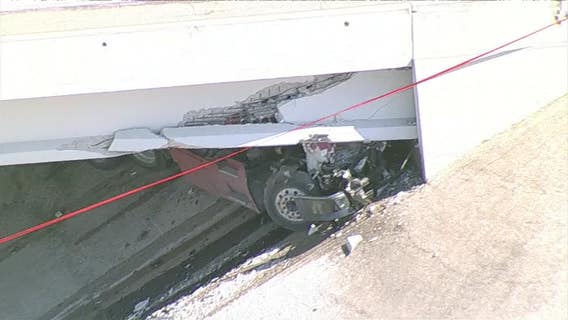 18-wheeler crashes under bridge in Euless