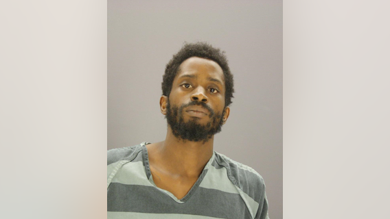 South Dallas murder suspect turns himself in, carrying alleged murder weapon
