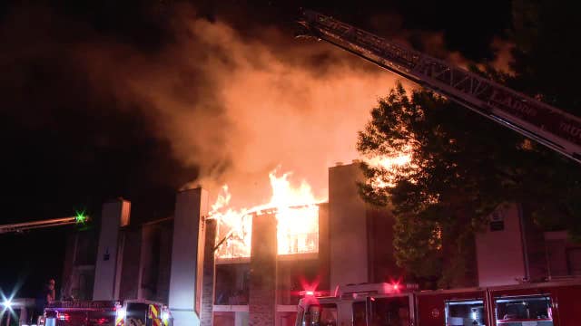 Large flames engulf roof of apartment complex in far east Dallas