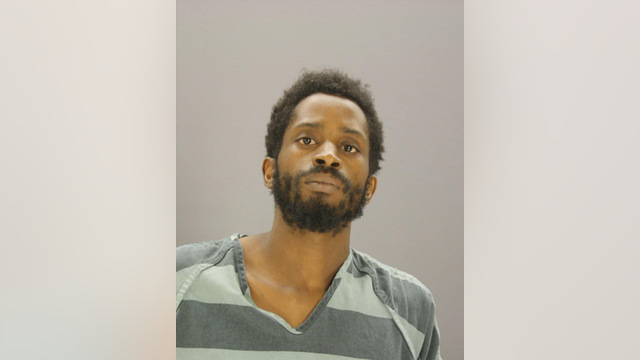 South Dallas murder suspect turns himself in, carrying alleged murder weapon