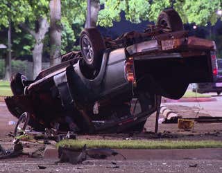 Surveillance video shows fatal street racing crash as car drives into oncoming traffic