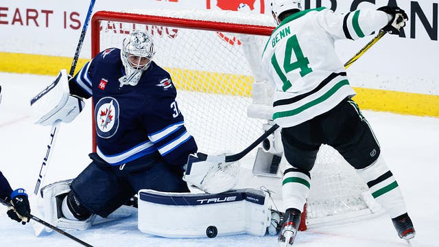 Connor Hellebuyck makes 21 saves, Jets beat Stars 4-0 in Game 2 to tie series