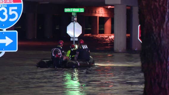 Man dies after truck trapped in rising Dallas floodwaters; Water rescue boat capsizes from rapid currents