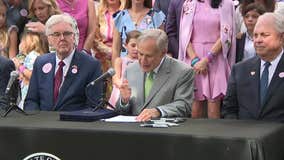 Abbott signs camp and flood safety bills with Camp Mystic families