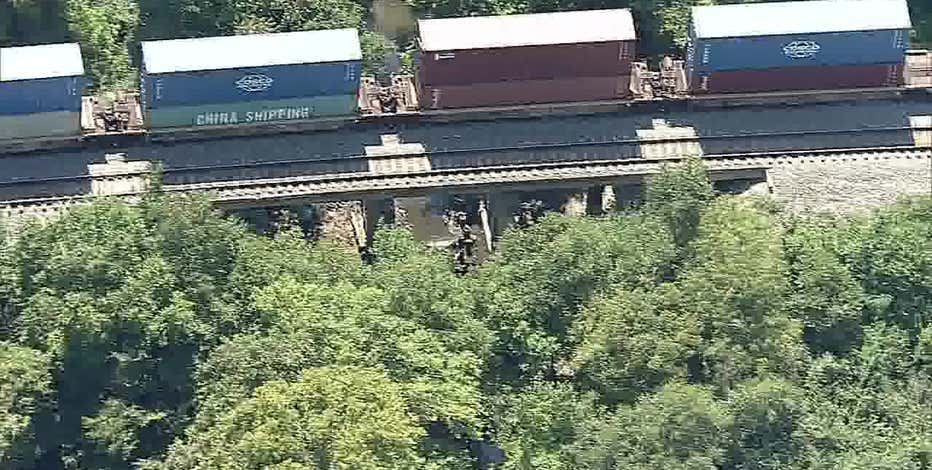Body discovered below train bridge in Arlington