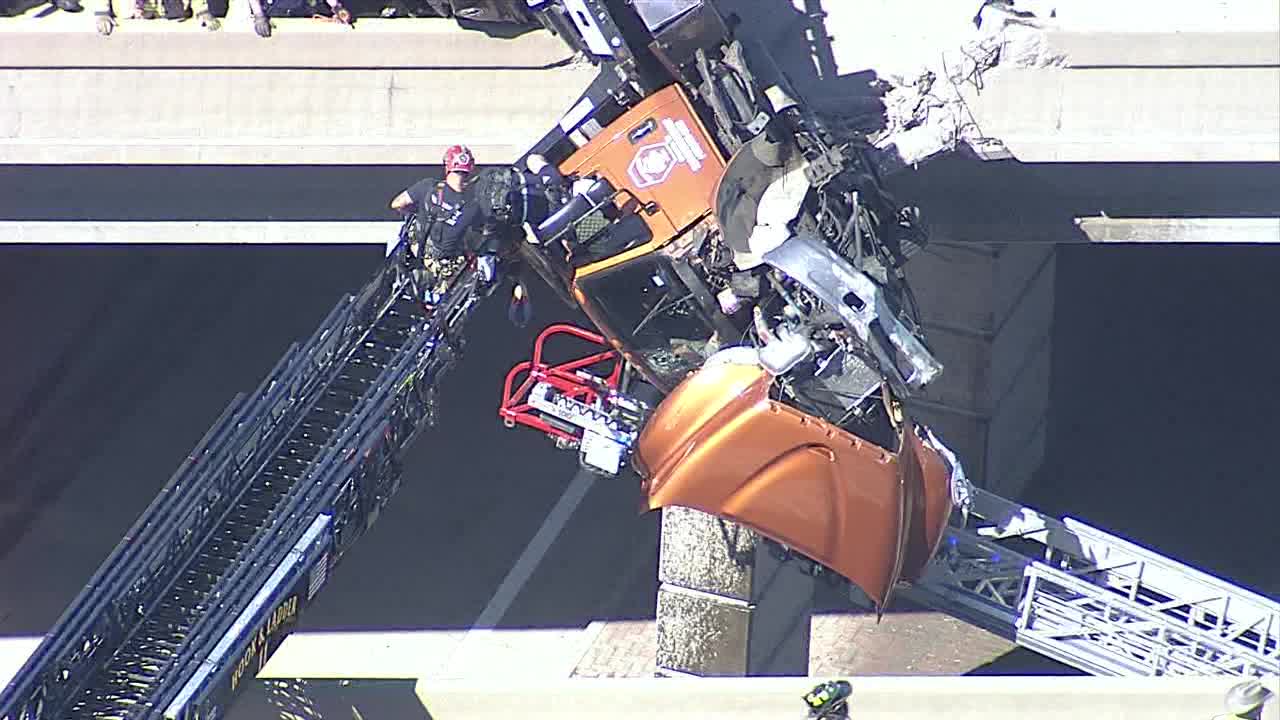 Tow truck hangs from overpass in McKinney, driver rescued