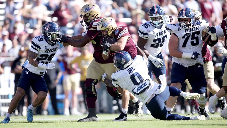 Lincoln Pare #7 of the Texas State Bobcats is tackled by Andrew Awe #0 of the Rice Owls during the first half of the 2026 Lockheed Martin Armed Forces Bowl at Amon G. Carter Stadium on January 02, 2026 in Fort Worth, Texas.