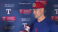 Rangers manager Skip Schumaker chats before first spring training game