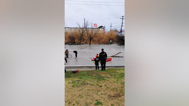 2 men rescued from Cottonwood Creek after being trapped by rising waters