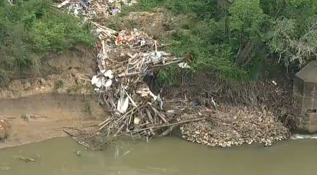 Dallas still working on plan to clear large illegal trash dump on Trinity River