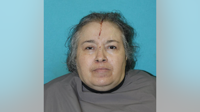 Carrollton woman arrested after husband found stabbed in burning home